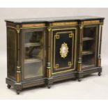 A late Victorian ebonized credenza with burr walnut banding, the central door inset with an oval