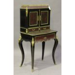 A late 19th century ebonized and boulle work bonheur-du-jour, decorated with overall panels of red