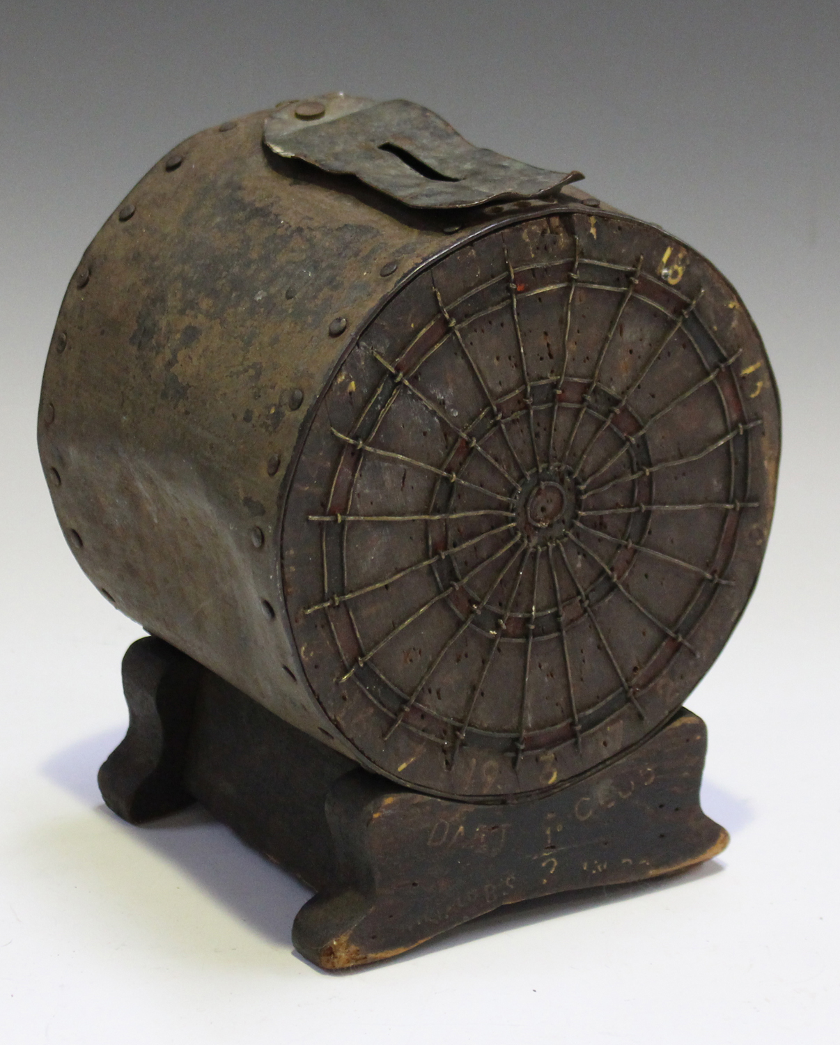 An early 20th century wooden and tin 'Darts Club' money box in the form of a dartboard, height 19cm,