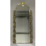 A 20th century Italianate gilt composition mounted arched wall mirror with shell surmount, 111cm x