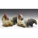 A pair of early/mid-20th century moulded composition models of seated chickens, length 39cm.Buyer’