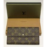 A Louis Vuitton monogram canvas purse, the interior with zip compartment, length 19cm, together with