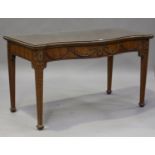 An early 20th century Neoclassical Revival mahogany serpentine fronted serving table, the frieze