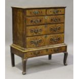 A George I walnut and marquetry inlaid chest-on-stand, the top profusely inlaid with a central urn