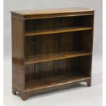 A 20th century Victorian style mahogany open bookcase, fitted with adjustable shelves, on bracket