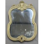 A 20th century rococo style wall mirror with shell surmount, 87cm x 54cm. Provenance: Findon