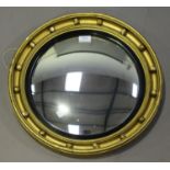 A 20th century Regency style gilt convex wall mirror, diameter 47cm.Buyer’s Premium 29.4% (including