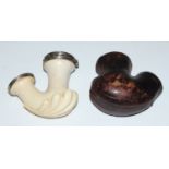 A 19th century German carved meerschaum and white metal mounted pipe of heavy gadrooned form, the