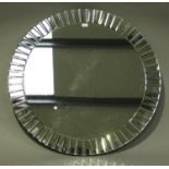 A modern circular wall mirror with bevelled edge, diameter 100cm.Buyer’s Premium 29.4% (including