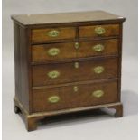 An 18th century oak chest of two short and three graduated long drawers, on bracket feet, height