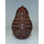 A 19th century carved and pierced coquilla nut box of pear form, length 5.3cm.Buyer’s Premium 29.