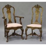 A set of ten early 20th century Queen Anne style walnut vase back dining chairs, comprising two