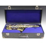 A mid-20th century German brass alto saxophone, the bell detailed 'Champion B & M, Made in GDR',