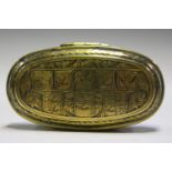 An 18th century Dutch brass tobacco box of oval form, the hinged lid engraved with three circular