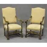 A pair of 20th century Baroque Revival walnut elbow chairs, the scroll arms carved with acanthus