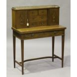 An Edwardian Neoclassical Revival mahogany bonheur-du-jour with inlaid decoration, the top fitted