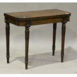 A William IV mahogany fold-over card table, raised on turned and tulip cusp tapering legs, height