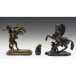 After Guillaume Coustou - an early 20th century brown patinated cast bronze model of a Marly horse