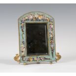 A late 19th century Italian gilt metal and micro-mosaic dressing table mirror, the arched frame with