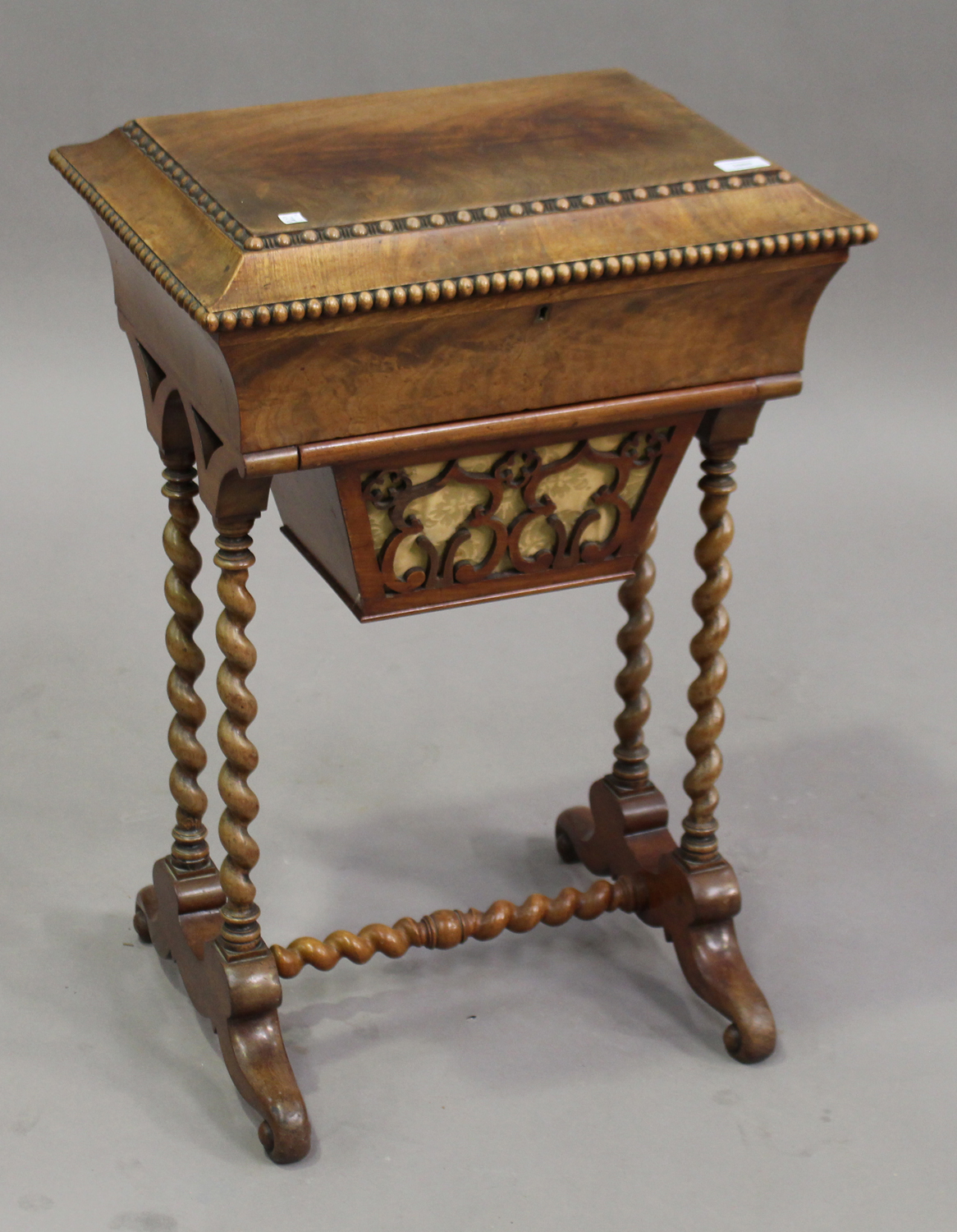 A mid-19th century Continental mahogany work table, the hinged lid revealing a mirror above a