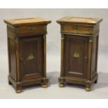 A pair of 20th century French Empire style mahogany side cabinets with gilt metal mounts, each