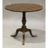 A 19th century mahogany circular tip-top wine table, raised on a turned column and tripod cabriole