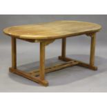 A late 20th century teak extending garden table by Westminster, height 74cm, length 181cm, depth