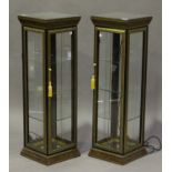 A pair of modern burr walnut-effect and gilt decorated upright pedestal display cabinets, each