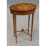 An Edwardian satinwood and foliate inlaid oval table by Edwards & Roberts, raised on square tapering