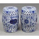 A pair of modern Chinese blue and white porcelain barrel shaped garden seats, decorated with overall