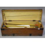 An early/mid-20th century lawn croquet set by F.H. Ayres, London, within its original pine box,