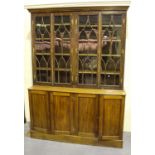 A 19th century and later mahogany bookcase cabinet, the moulded pediment above four astragal