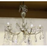 A mid-20th century silvered cast metal five-branch chandelier, hung with large clear glass drops,