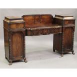 An early Victorian mahogany twin pedestal sideboard, fitted with four frieze drawers and panelled