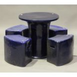 A 20th century blue glazed pottery circular garden table and four matching seats, diameter of