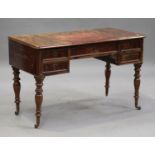 A Victorian mahogany writing table, the hinged writing surface above five drawers, on turned legs,