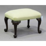 A 20th century Chippendale style mahogany stool, the overstuffed seat raised on carved cabriole legs