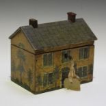 A 19th century painted wooden box in the form of a house, the open door painted with pet dog,