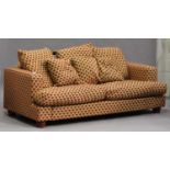 A modern three-seat sofa, upholstered in patterned fabric, on turned feet, height 78cm, width 227cm,