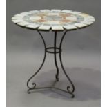 A late 20th century French circular garden table with sectional marble top, raised on a wrought