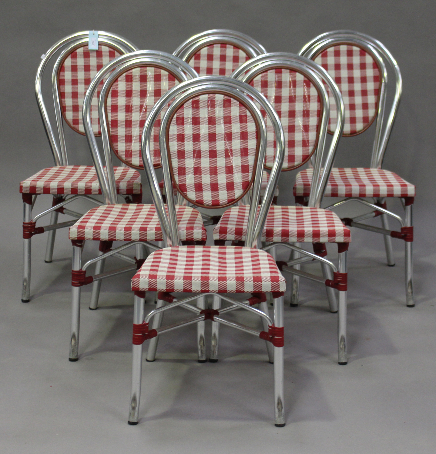 A set of six late 20th century French aluminium café chairs with woven seats.Buyer’s Premium 29.