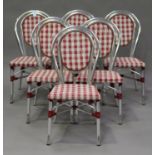 A set of six late 20th century French aluminium café chairs with woven seats.Buyer’s Premium 29.