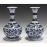 A pair of modern Chinese blue and white porcelain vases, the waisted necks and bulbous bodies