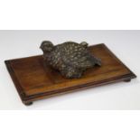 A late 19th century Austrian cold painted cast bronze desk tidy in the form of a bird and its two