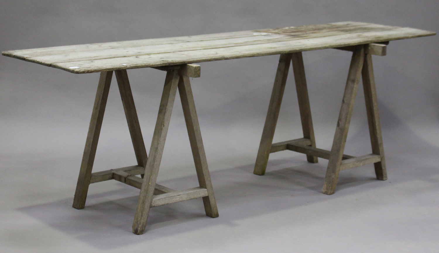 A 20th century pine trestle table, the three-plank top raised on two 'A' frame supports, height