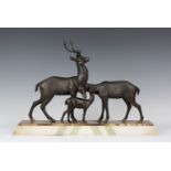 Rochard - an Art Deco patinated cast spelter model group, depicting a family of deer, all standing