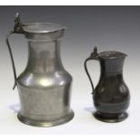 A late 19th century pewter tappit-lidded flagon with twin acorn thumbpiece, height 26cm, together