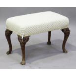 An early 20th century George I style walnut stool, the overstuffed seat upholstered in cream