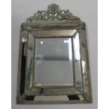 A 20th Dutch style brass mounted sectional wall mirror, the arched crest and frame with applied