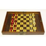 A late 19th century Jaques 'In Statu Quo' patent mahogany cased travelling chess set, the interior